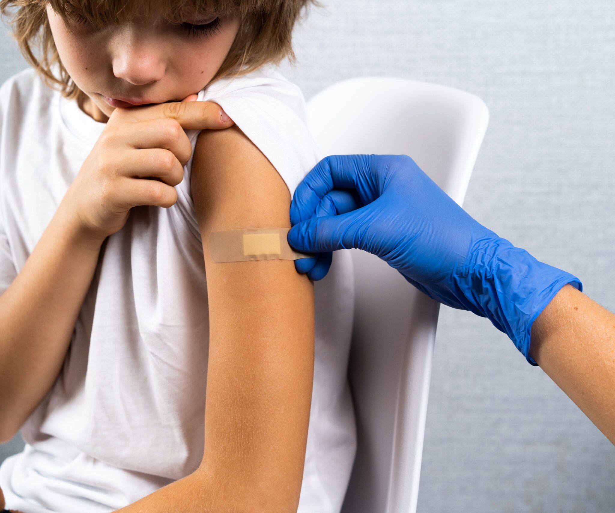 vaccination of children, a little boy at a doctor’s appointment, an injection in the arm, children’s medicine, an injection in the arm vaccination of children, a little boy at a doctor's appointment, an injection in the arm, children's medicine, an injection in the arm.